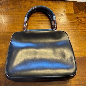 Vintage Gucci leather bag with bamboo and leather handles. Red leather interior